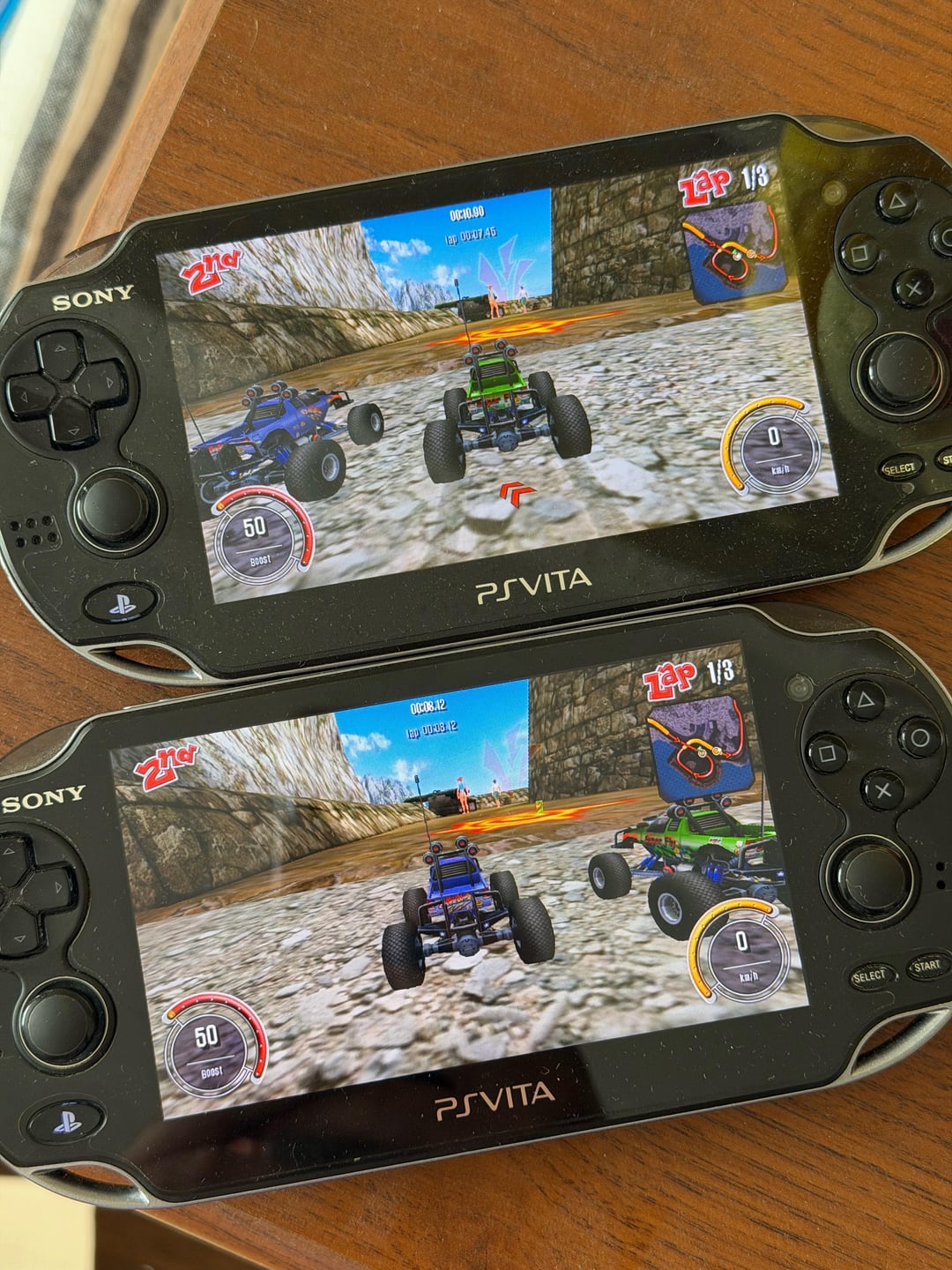 RC Cars gameplay photographed on two PS Vita consoles